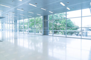 Blurred abstract background interior view looking out toward to window and greenery